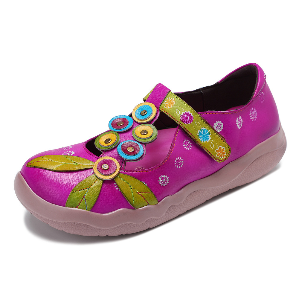 Colourful patterned flat shoes with a strap across the instep