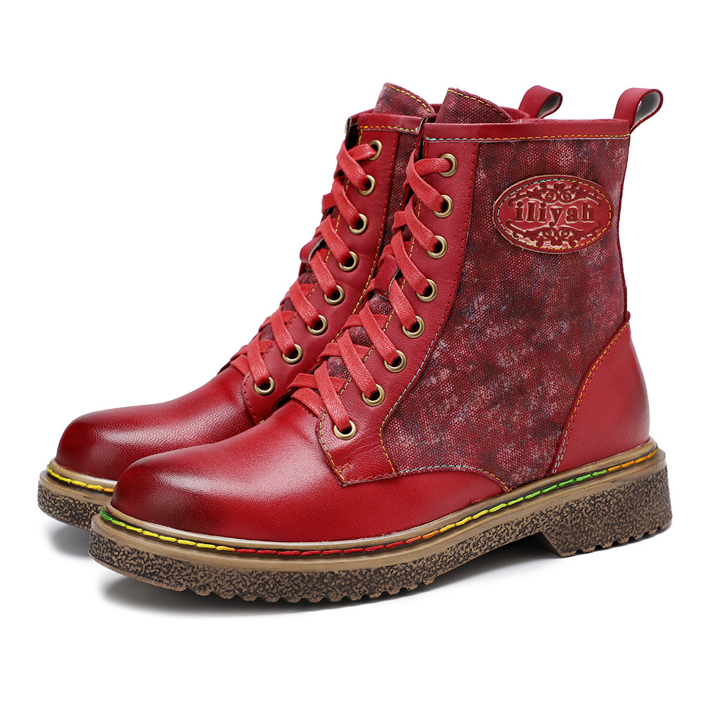 Red lace-up ankle boots with dark trim and floral panel details